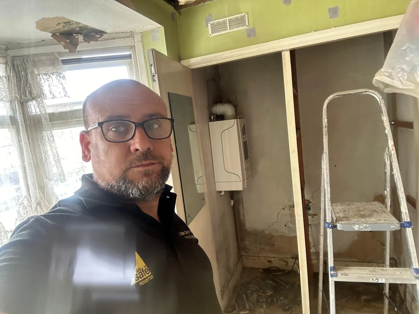 Bashir Ahmad, founder of Gas Direct Service, on site in a Gas Direct Service polo